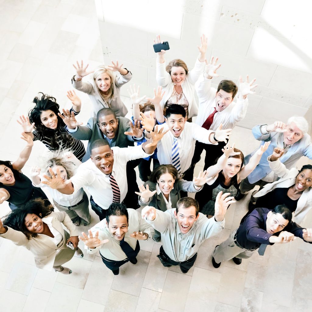A photo of a team of happy employees taken from above